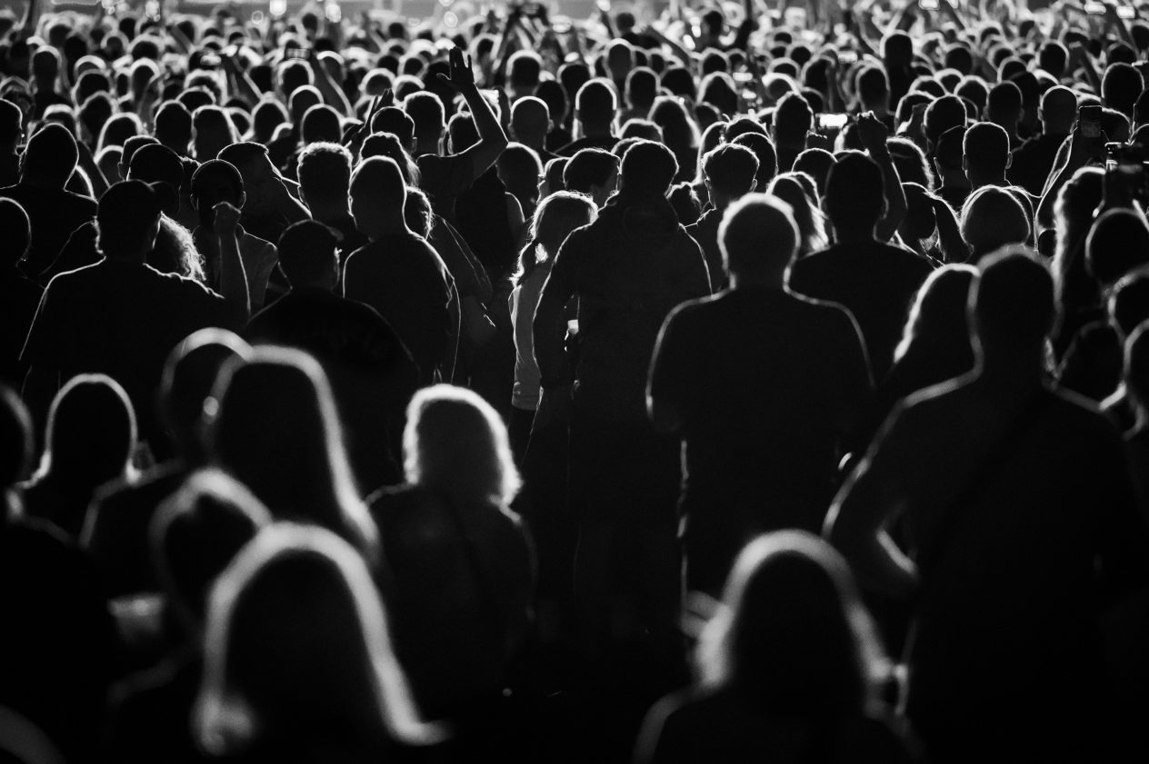 A crowd of people in silohoutte